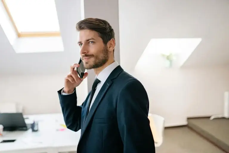 A man standing while on a cell phone