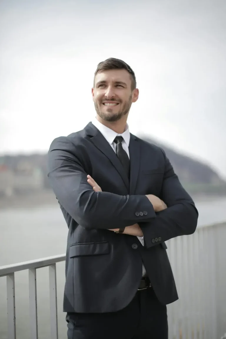 Businessman-standing-on-balcony Businessman standing on balcony